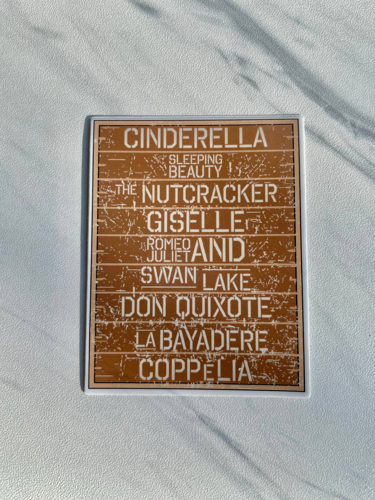 Wooden sign with ballet names on a white background