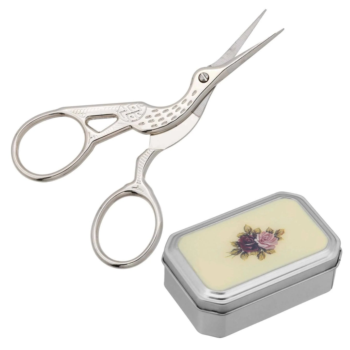 Silver embroidery scissors with a decorative case on a white background. Pointe shoe scissors for dancers.