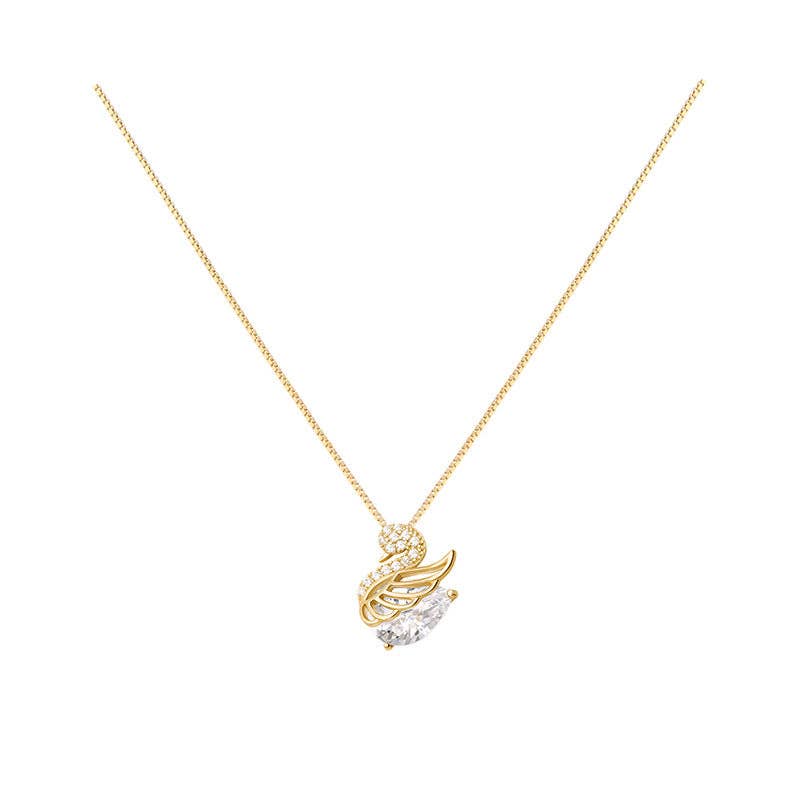 Gold necklace with swan pendant on a white background