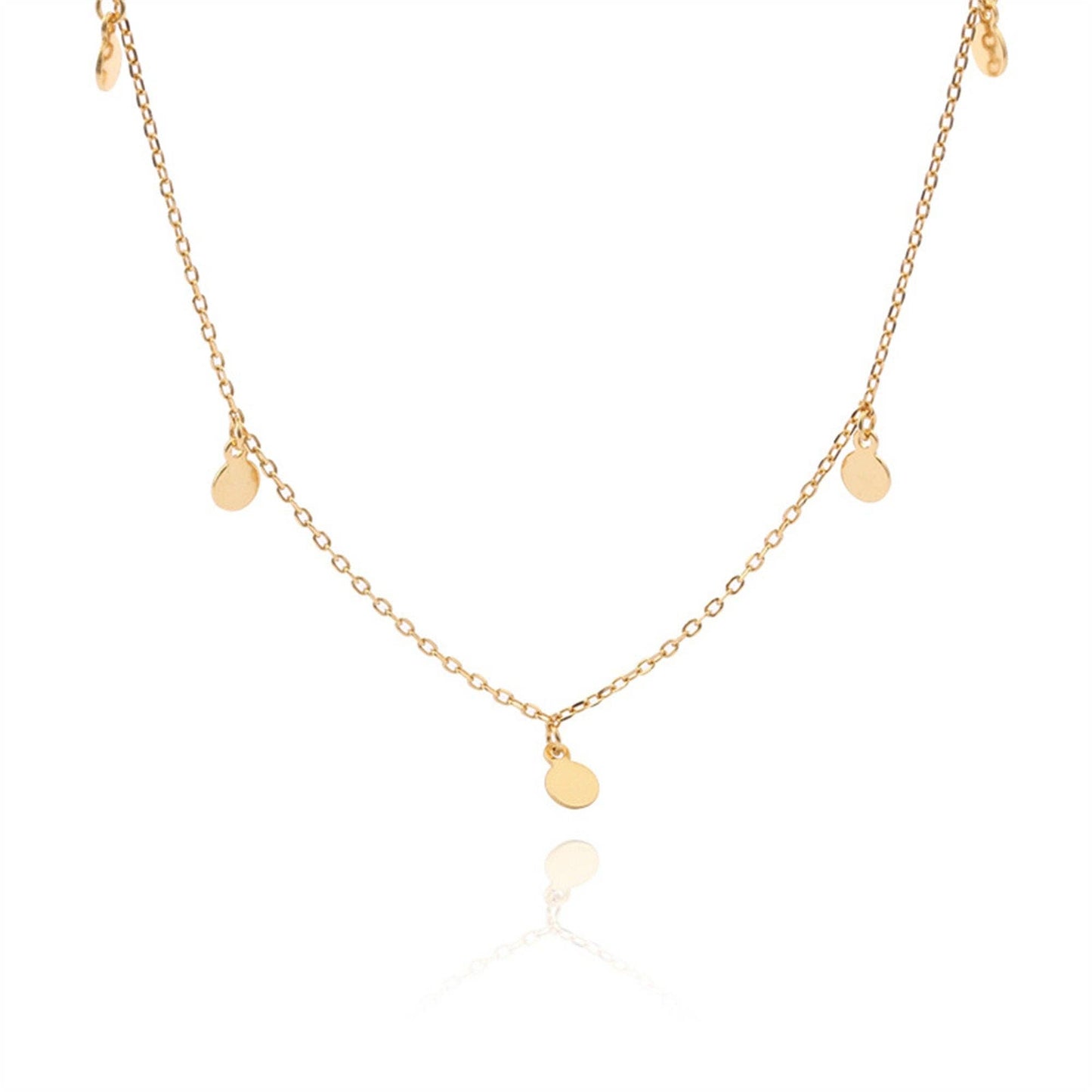 Gold necklace with small round pendants on a white background
