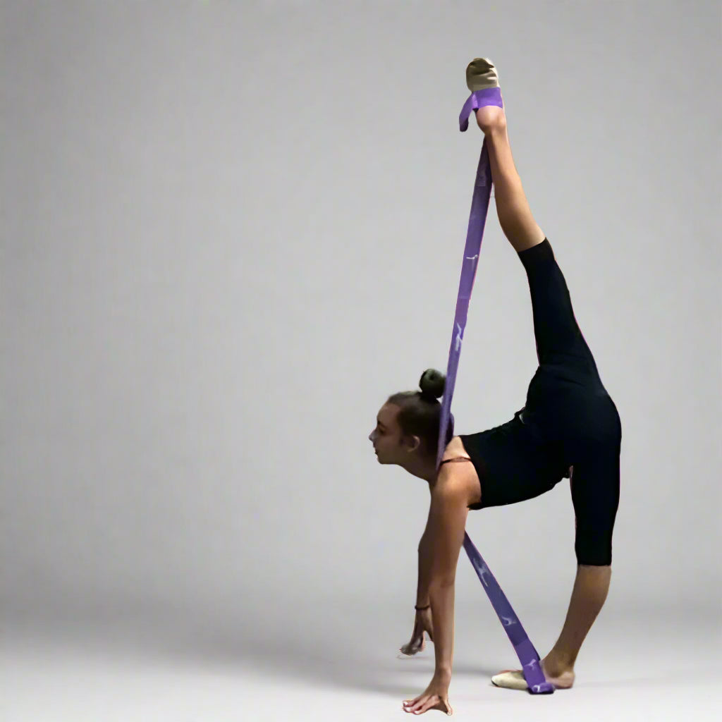 Person using a balletstrap in a gym setting with 'ADS' branding.