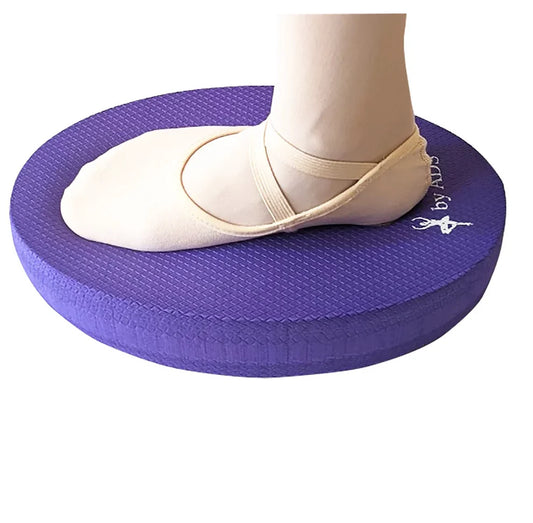 Purple balance pad with a foot wearing a ballet shoe on a white background