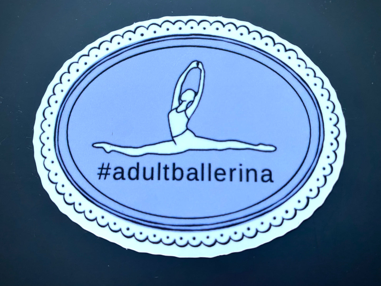 Sticker with a dancer illustration and '#adultballerina' text on a blue background