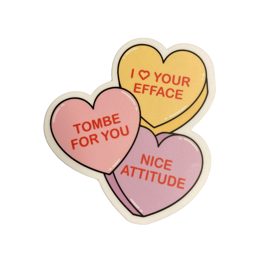 Heart-shaped stickers with humorous text on a white background