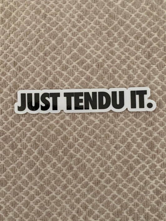 Sticker with 'JUST TENDU IT.' text on a textured beige background