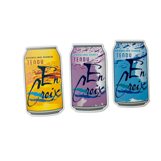 Three colorful cans of Tendu En Croix sparkling dance on a white background