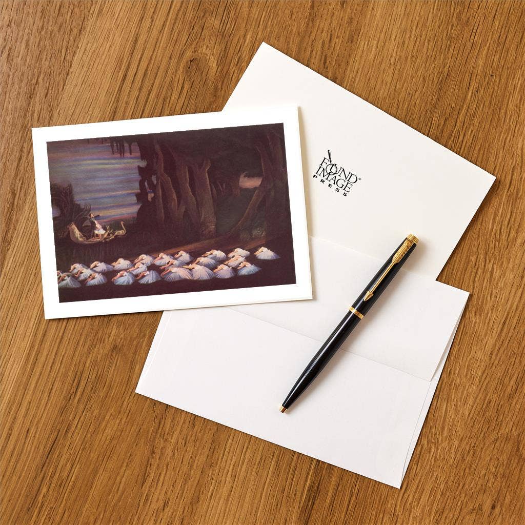 Greeting card with illustration of sheep, pen, and envelope on wooden surface