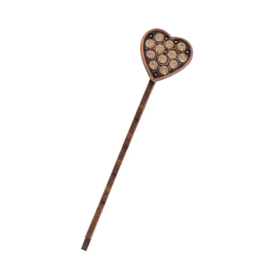 Heart-shaped hairpin with rhinestones on a white background