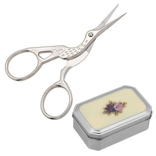 Silver embroidery scissors with a decorative case on a white background. Pointe shoe scissors for dancers.