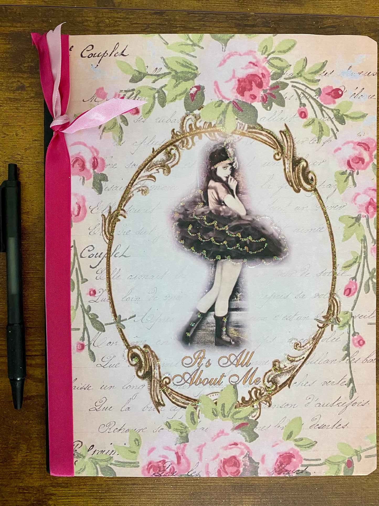 Decorative notebook with floral design and a girl in a tutu