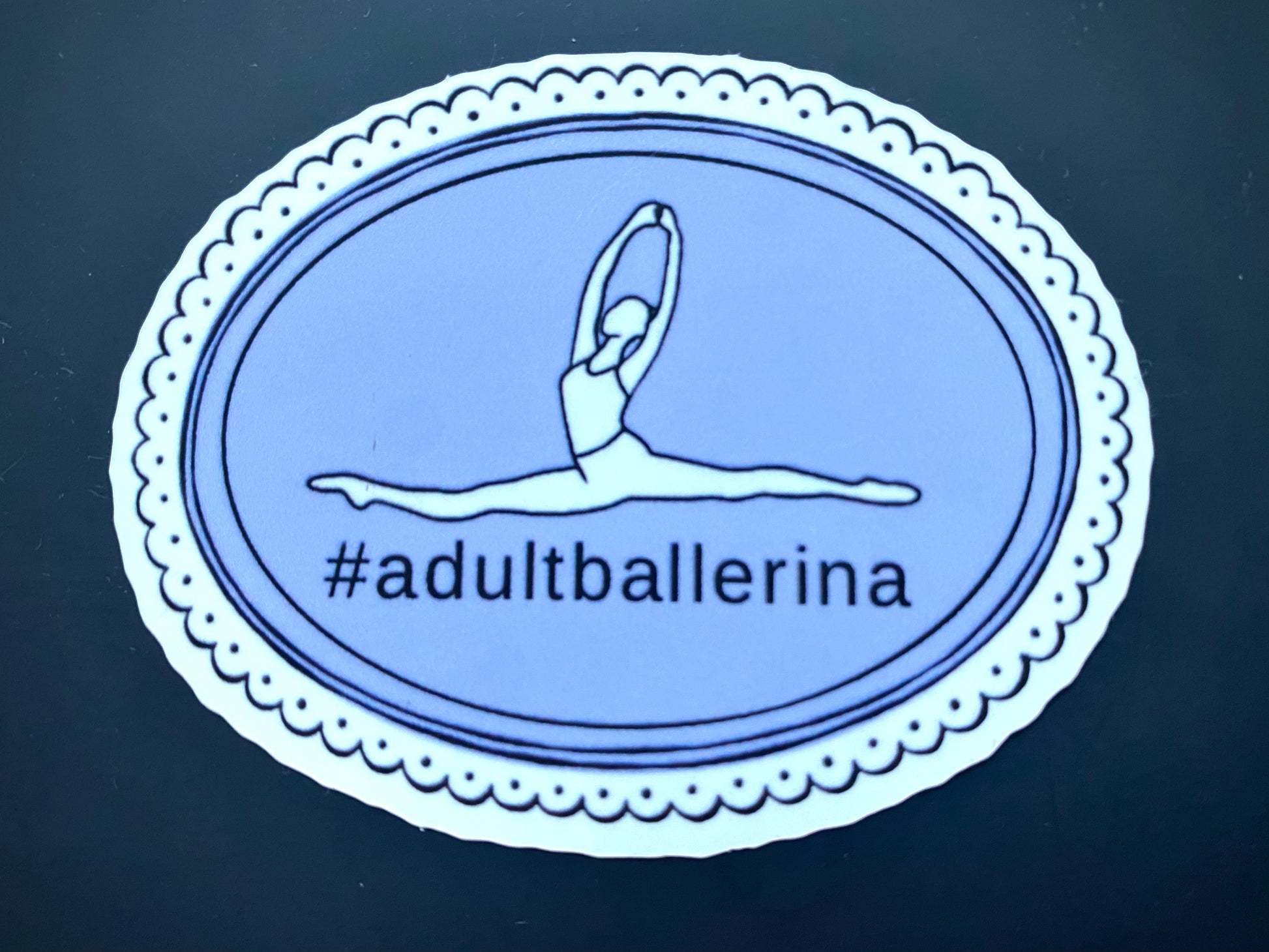 Sticker with a dancer illustration and '#adultballerina' text on a blue background