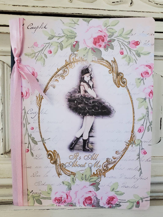Decorative notebook with floral design and illustration of a ballerina on a white background