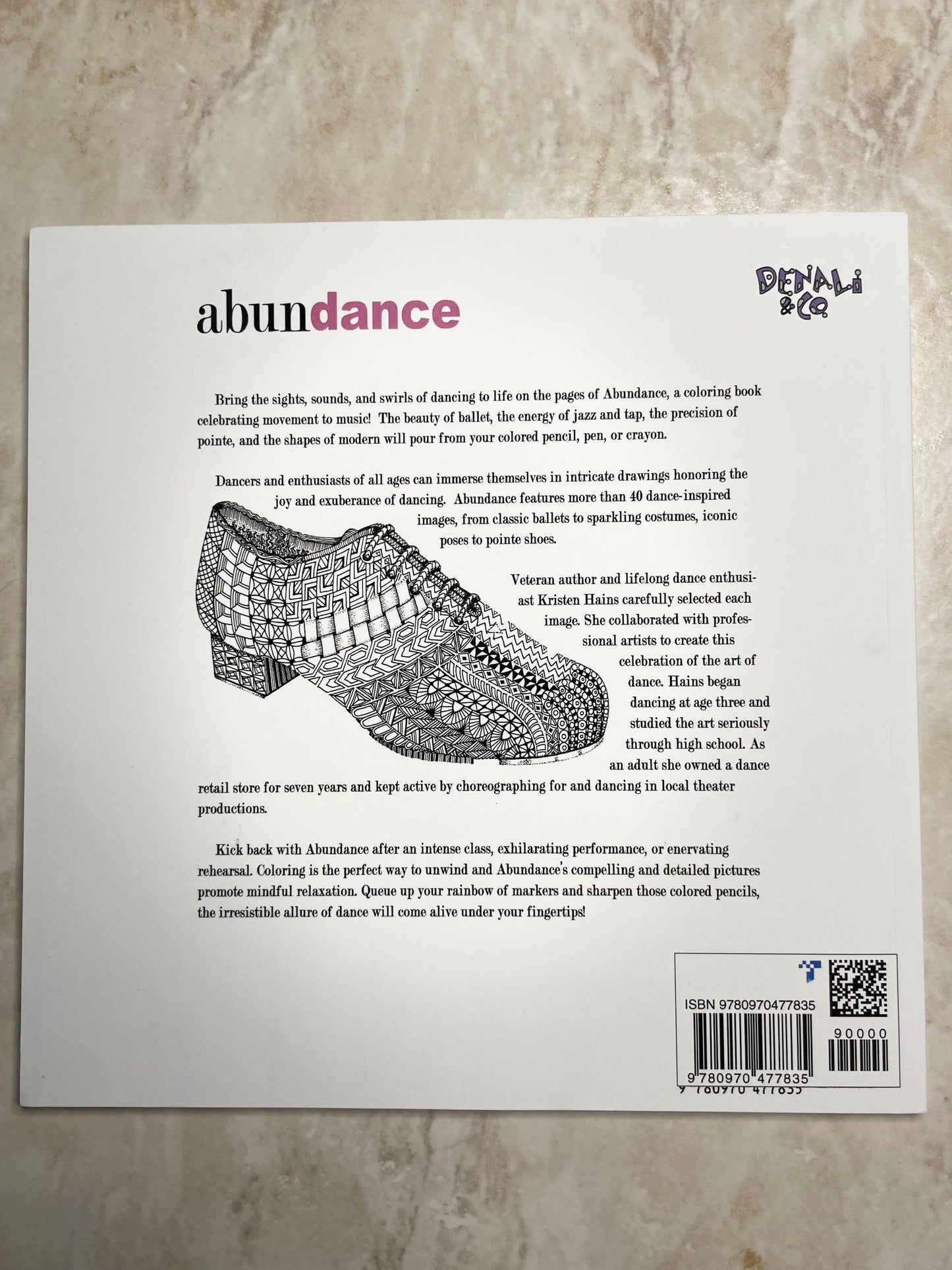 Product packaging with text and a shoe design on a textured surface