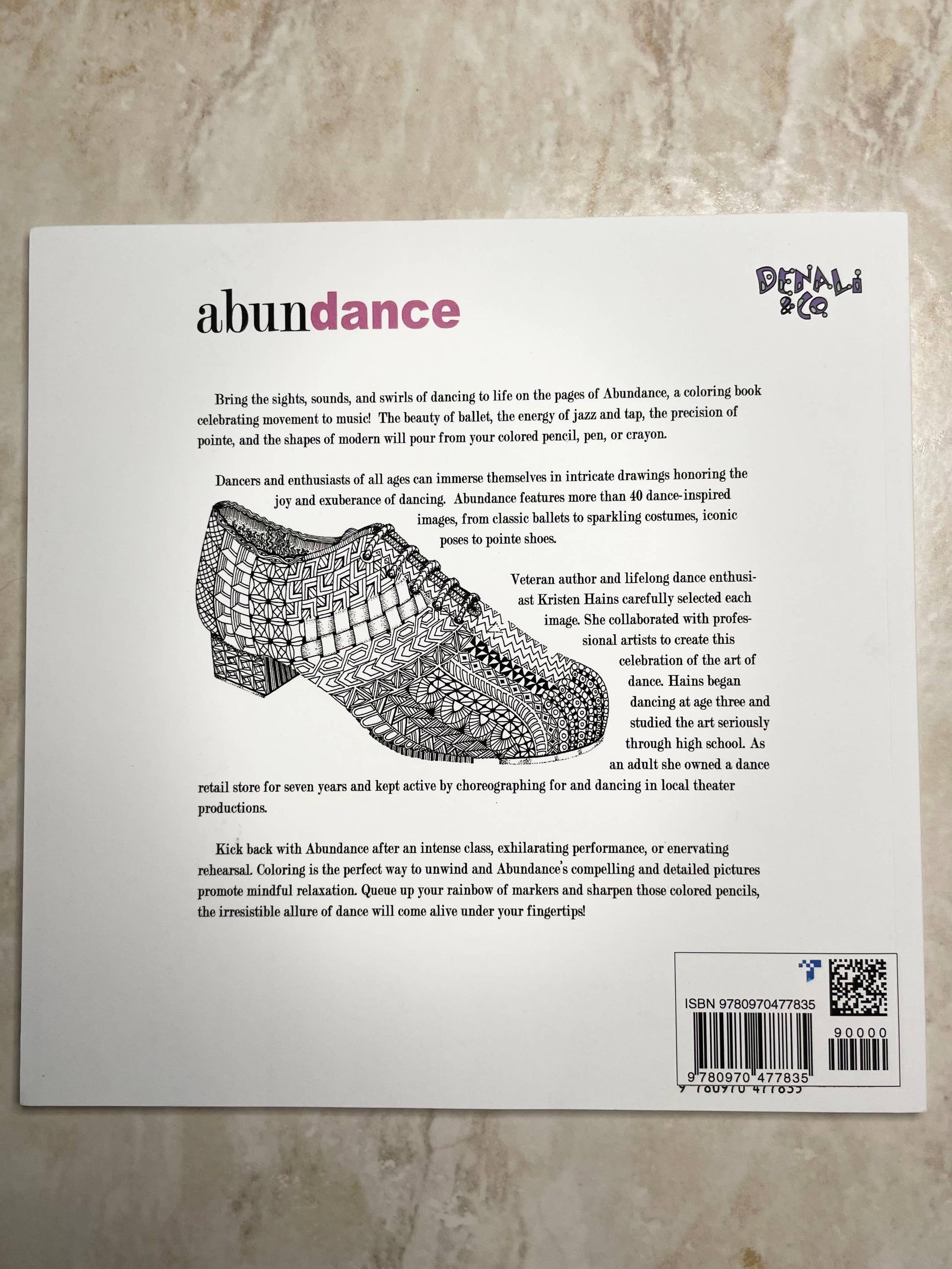 Product packaging with text and a shoe design on a textured surface